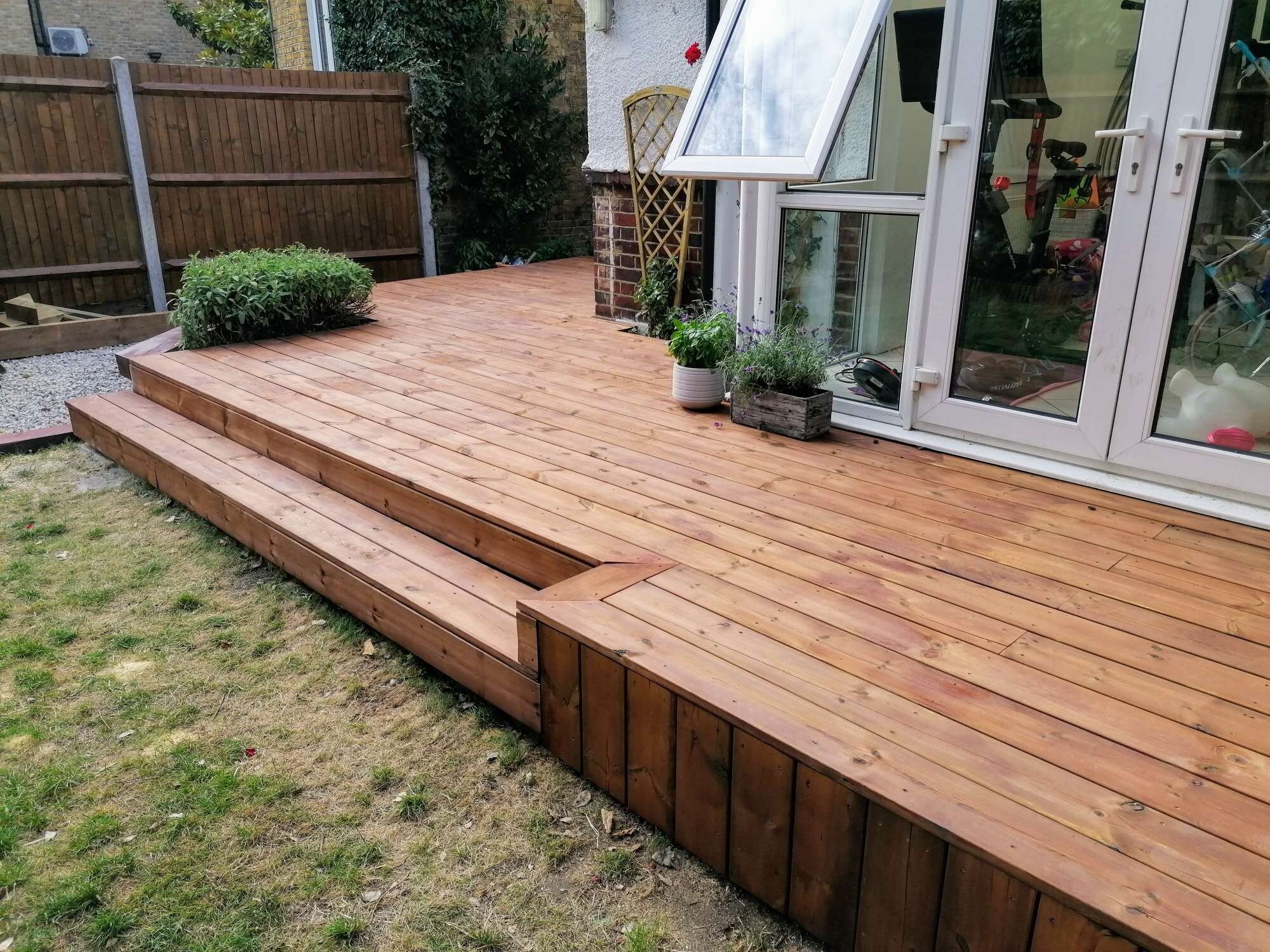 Photo of Smooth Softwood Decking in Garden behind house in Kingston KT1