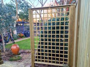 View of standalone partial Trellis Panel separating garden into sections