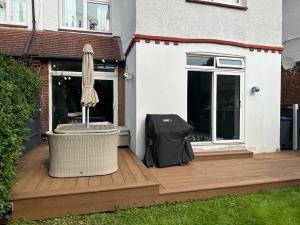 Image of recent Millboard Enhanced Grain Coppered Oak Decking installed in Wimbledon SW19